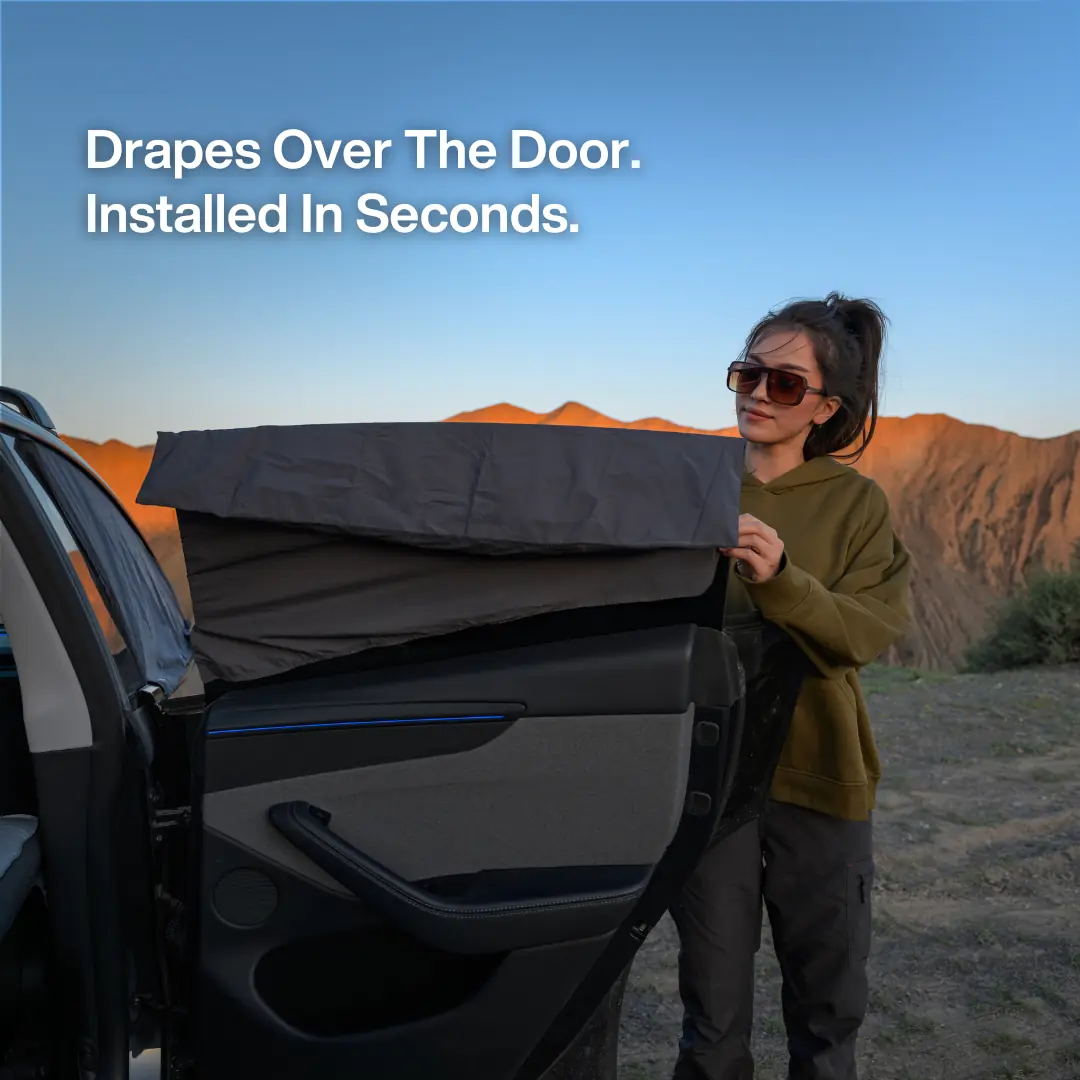 Havnby DreamShade panel draped over an open Tesla door during installation