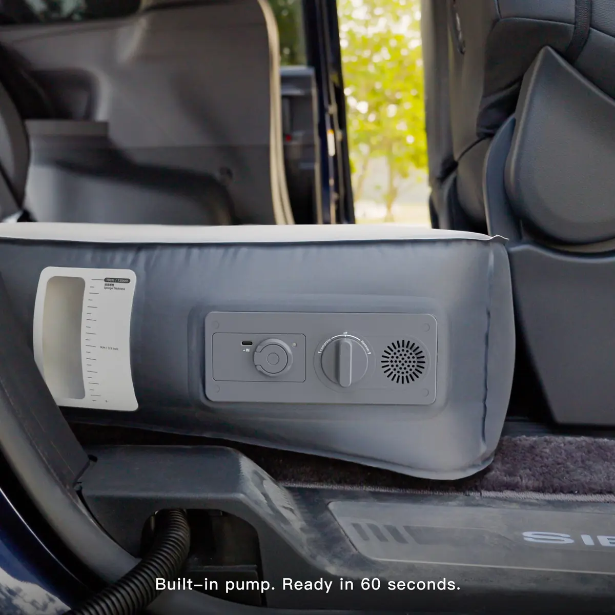Havnby FlatCore mattress pump control panel inside a Toyota Sienna, showing the Compress and Recover dial and part of the Sienna door-sill badge