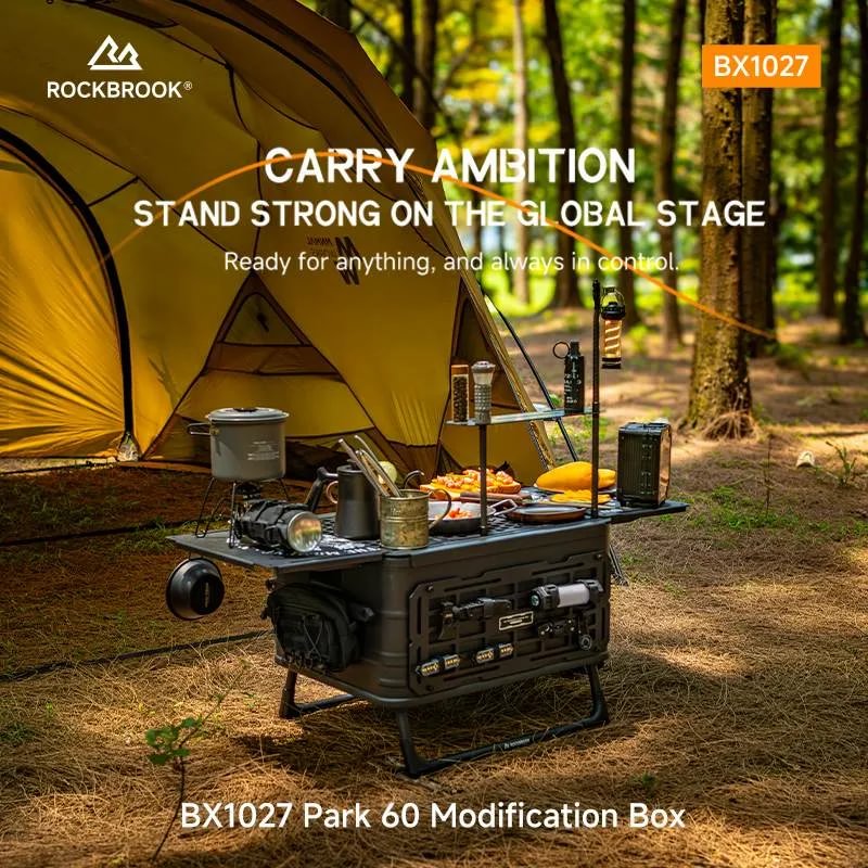 ROCKBROOK BX1027 Park 60 aluminum box deployed as a camp kitchen with stove, cookware and table beside a tent