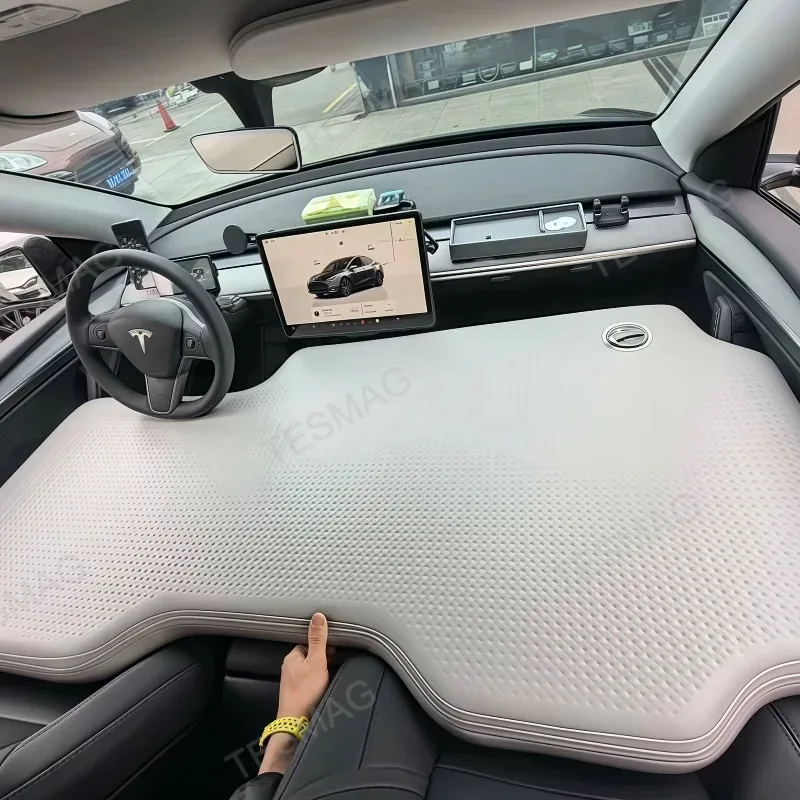TESMAG front-seat air mattress installed across a parked Tesla cabin